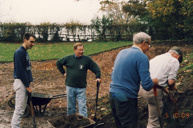 2.lawn1_edited-1.jpg - Removing the clay from the whole lawn area. Doug T/Roger T/ an Aussi visitor/ John K/ Bill S.